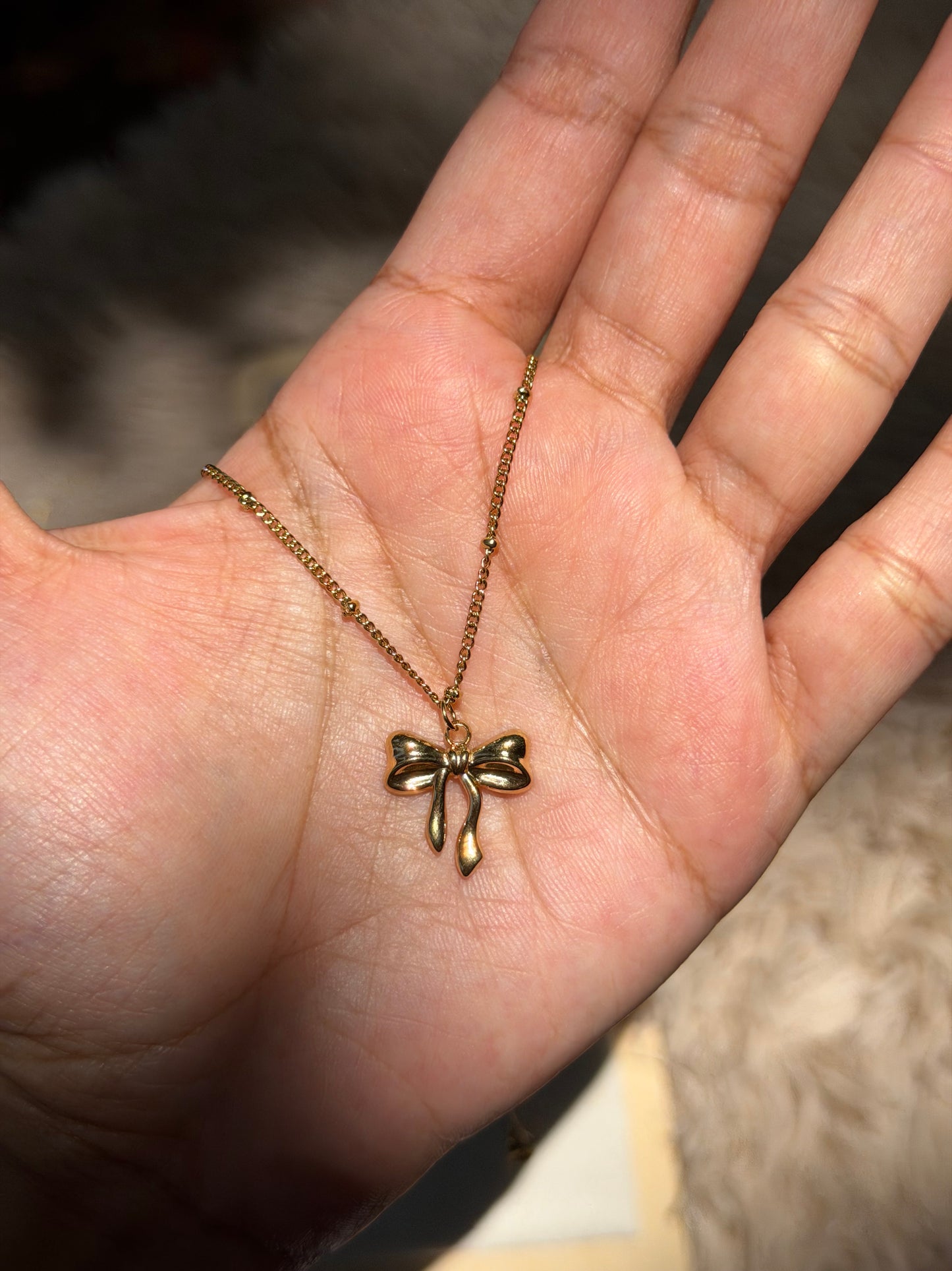 Anti tarnish bow pendant